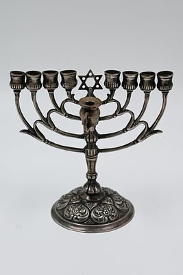 Upright menorah in a small format - Austria-Hungary 
An upright silver menorah. Austria-Hungary 