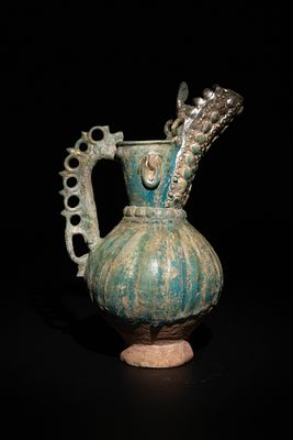 An Islamic Khorassan Glazed Ceramic Ewer with Ornate Spout and Handle, 12th Century. This 