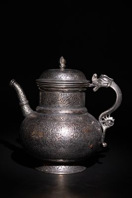 An Islamic Timurid Copper Ewer with Engraved Calligraphy and Dragon Handle. A copper ewer 