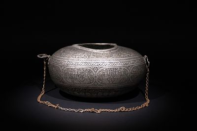 An Islamic Iron Kashkul Beggar's Bowl with Courtly Figures &amp; Floral Patterns. A finely 