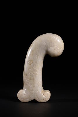 A Mughal White Jade Dagger Hilt, 19th-20th Century. Carved from white jade, the hilt is 