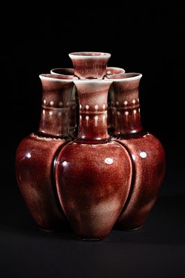 A Chinese Sang de Boeuf Glazed Porcelain Five-Neck Vase. A multi-necked porcelain vase featuring 