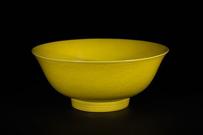 A Chinese Yellow Glazed and Incised Porcelain 'Dragon' Bowl, Yongzheng Mark. A yellow glazed and 