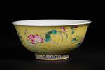 A Chinese Famille Rose Yellow-Ground Bowl, Kangxi Mark. A polychrome porcelain bowl with a deep Image - 1