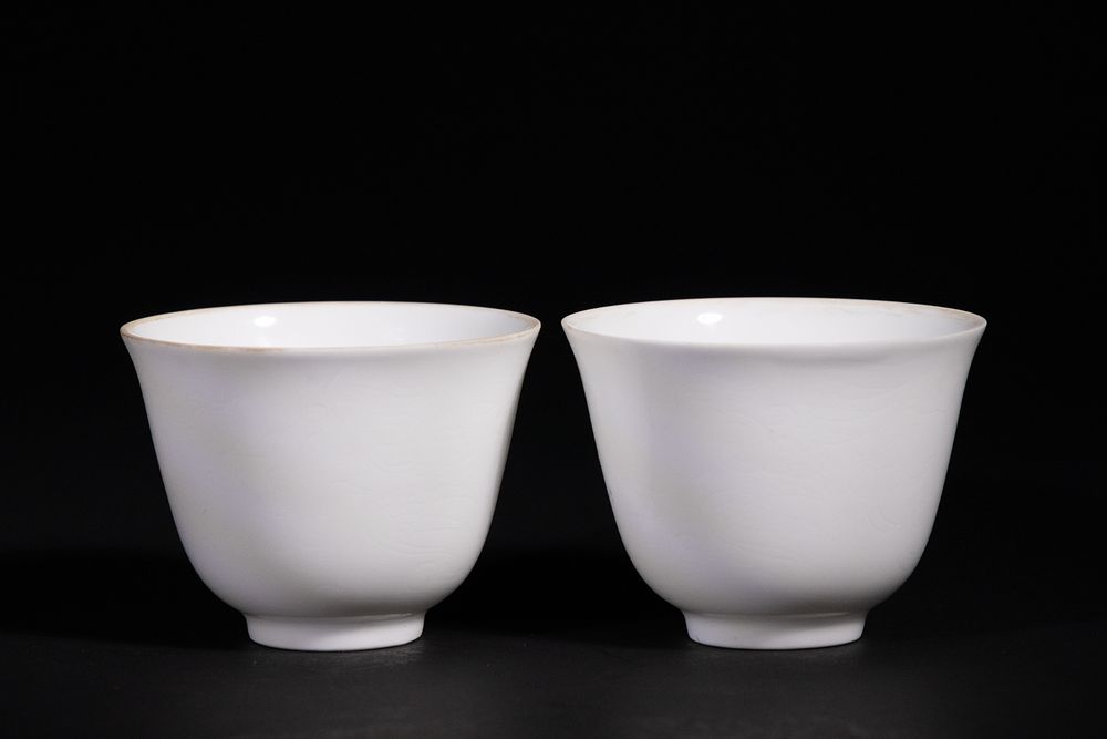A Pair of Chinese White Glazed Porcelain Cups with Anhua Dragon and Phoenix Decoration 