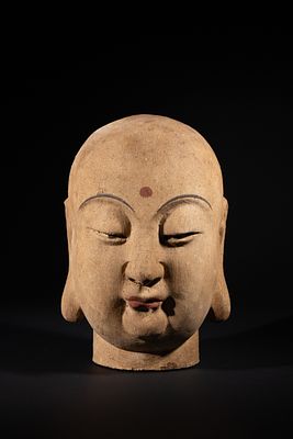 A Chinese Terracotta Head of a Lohan or Buddhist Monk. A Chinese earthenware head depicting a 