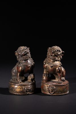 A Pair of Chinese Bronze Gilt and Lacquered Guardian Lions Foo Dogs. A pair of Chinese cast 