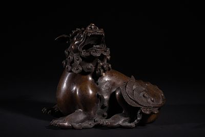 A Chinese Bronze Lion Censer, 19th Century. A patinated bronze figure of an East Asian-style 
