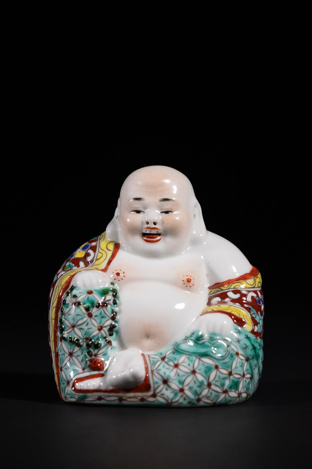 A Chinese Famille Rose Porcelain Maitreya Buddha Figurine. A Chinese Famille Rose porcelain 