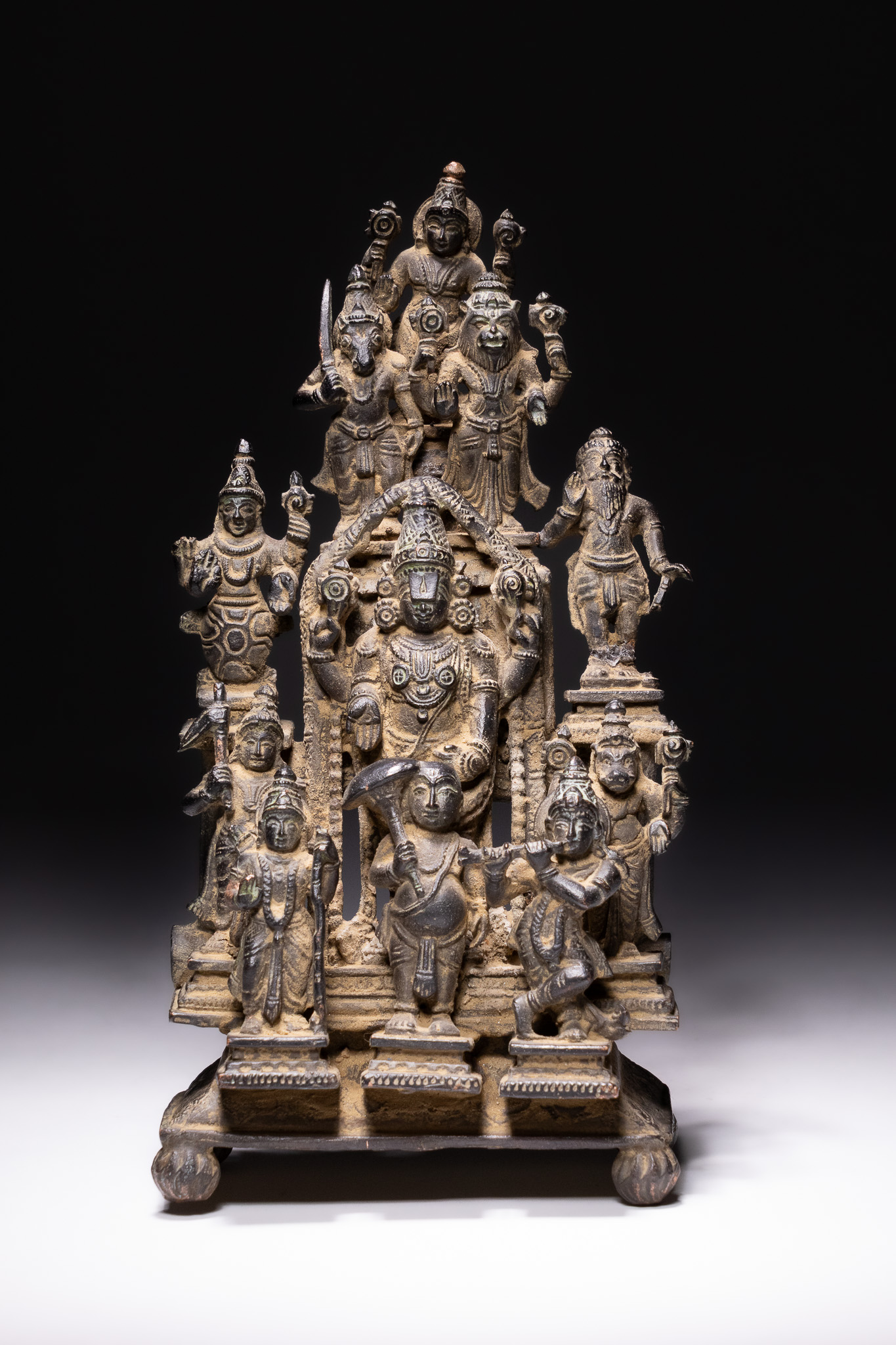 A SOUTH INDIAN COPPER ALLOY SHRINE OF VISHNU AND THE DASHAVATARA, 18TH-19TH CENTURY.