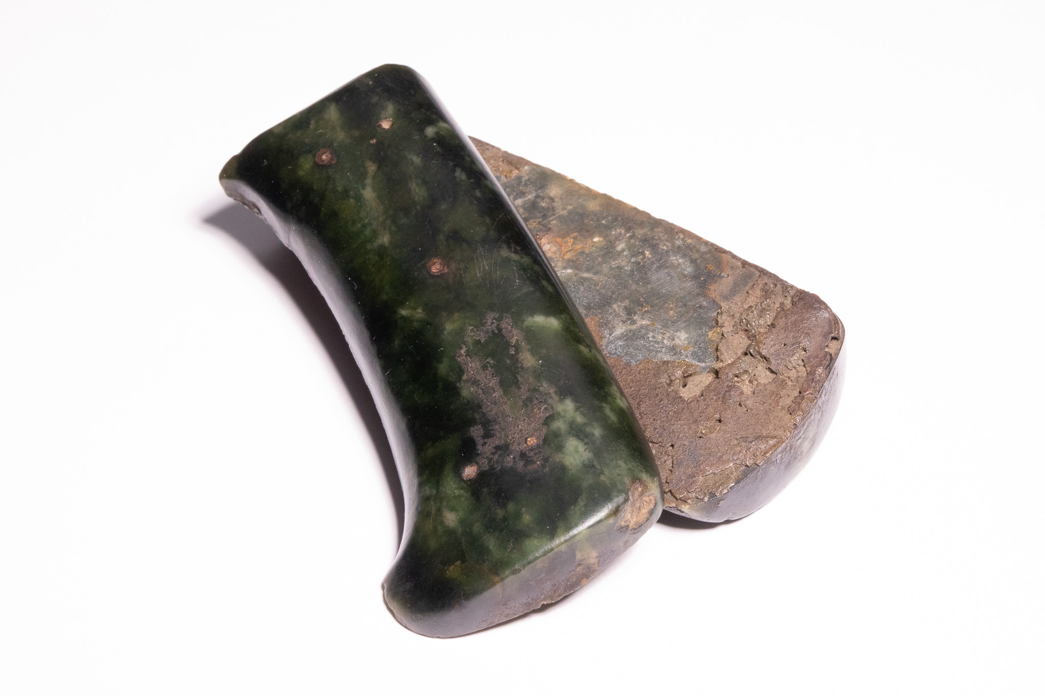 A PAIR OF INDO-PERSIAN CARVED JADE AXEHEADS, 18TH/19TH CENTURY.
