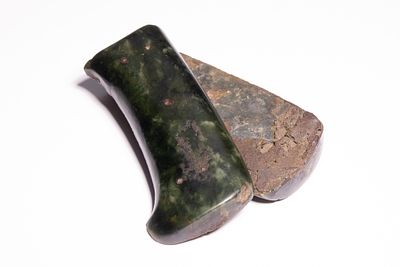 A PAIR OF INDO-PERSIAN CARVED JADE AXEHEADS, 18TH/19TH CENTURY. A pair of carved hardstone 