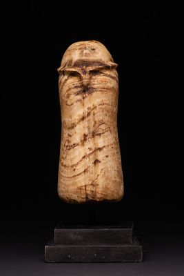 AN ANCIENT ALABASTER ANTHROPOMORPHIC IDOL, EARLY BRONZE AGE, CIRCA 3000–2000 BC. A carved 