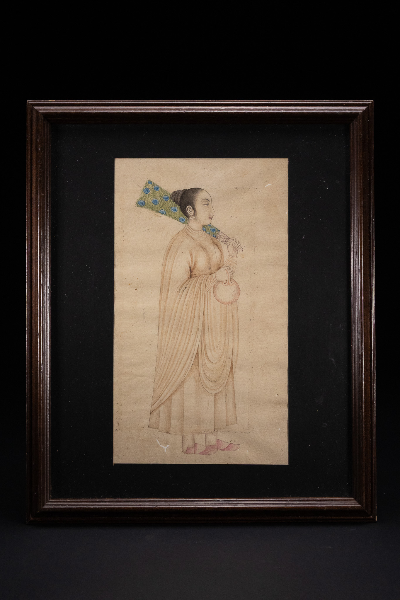 A NORTH INDIAN MINIATURE PAINTING OF A FEMALE ATTENDANT, 18TH OR 19TH CENTURY.