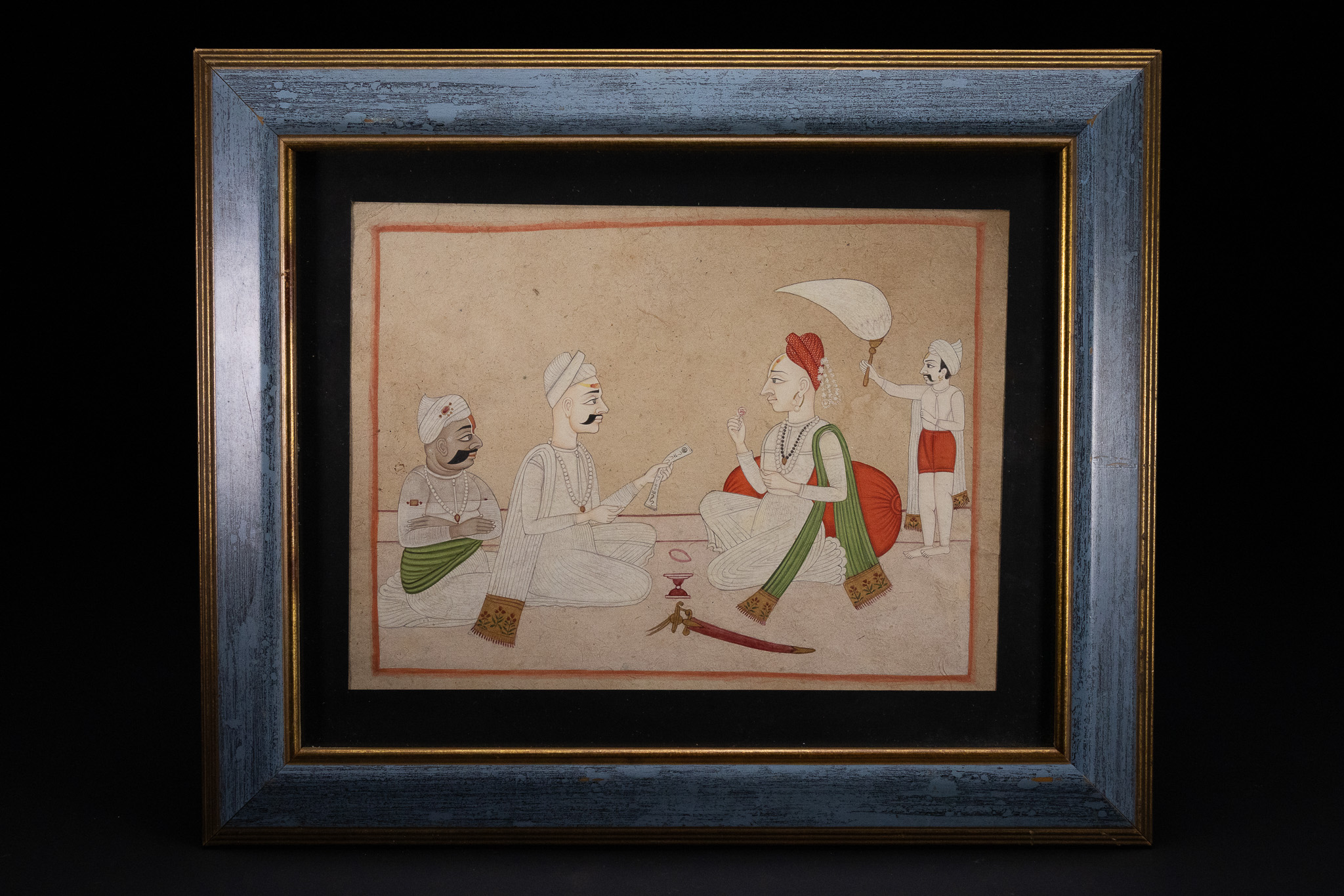 AN INDIAN PAHARI SCHOOL MINIATURE PAINTING OF 'A SEATED RAJA RECEIVING A COURTIER', 19TH CENTURY.