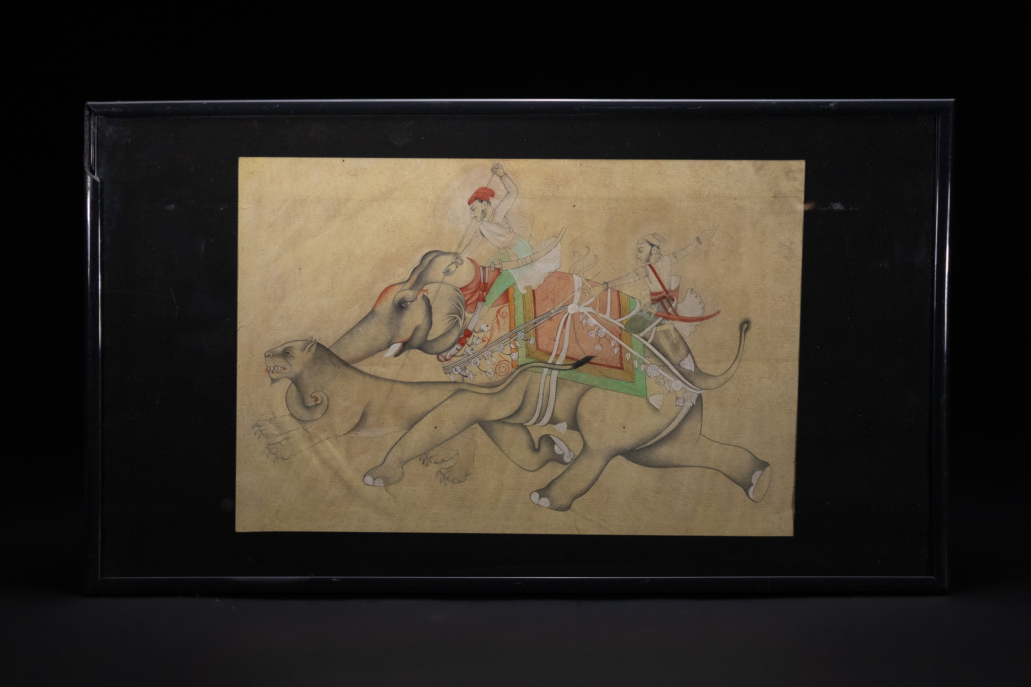 AN INDIAN SCHOOL MINIATURE PAINTING OF A HUNTING SCENE WITH ELEPHANT AND LION, 19TH CENTURY.