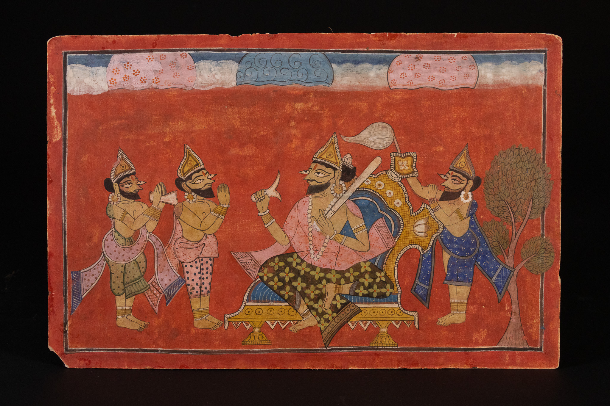 A NORTH INDIAN PUNJAB REGIONAL SCHOOL MINIATURE PAINTING DEPICTING A SEATED FIGURE WITH ATTENDANTS, 18TH/19TH CENTURY.