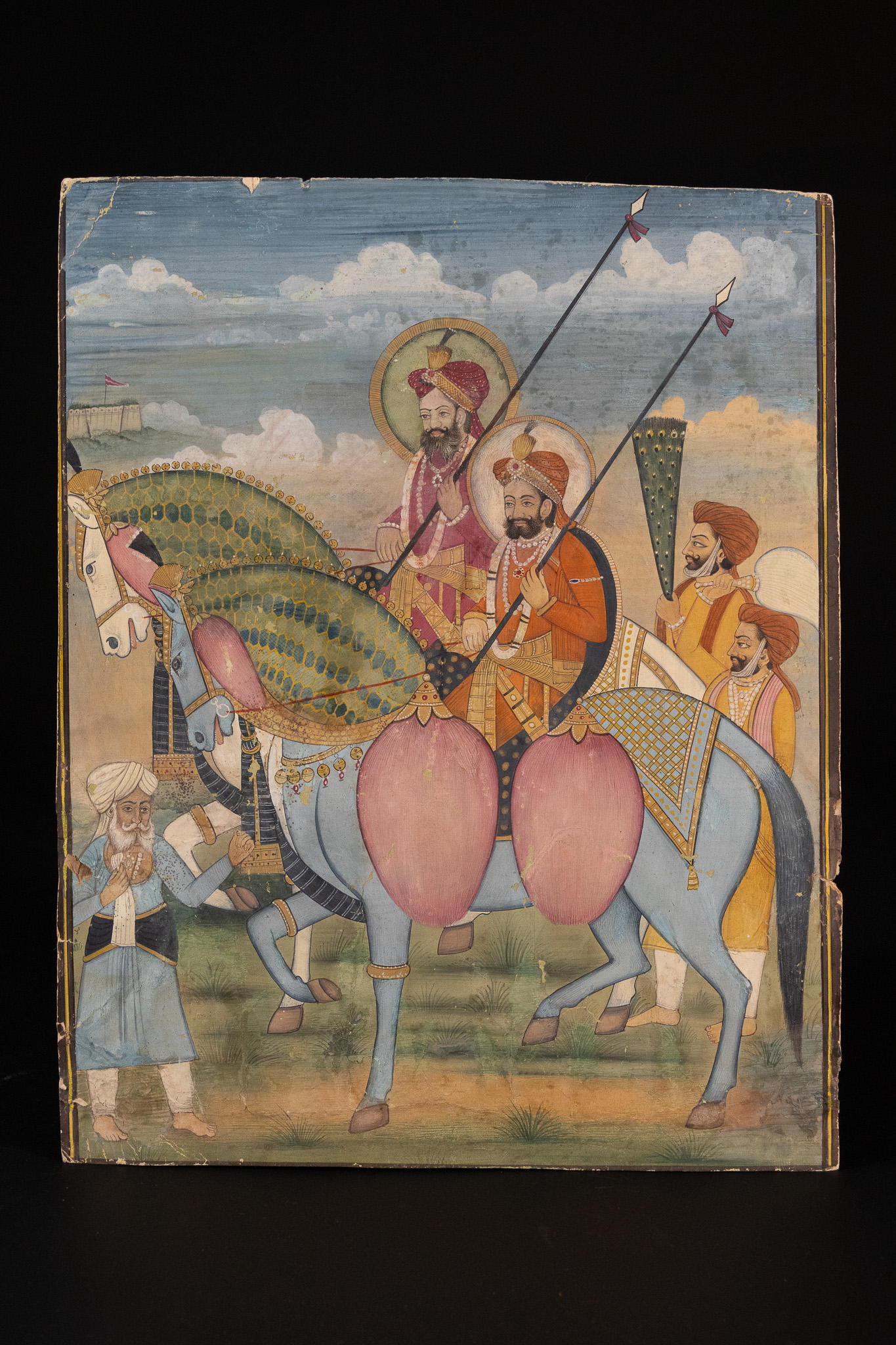 A NORTH INDIAN SIKH SCHOOL MINIATURE PAINTING DEPICTING AN EQUESTRIAN PROCESSION, 19TH CENTURY.