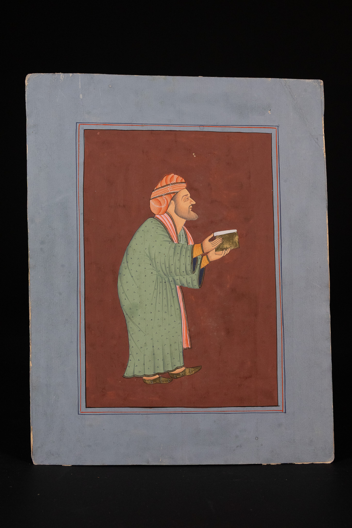 PROVINCIAL MUGHAL SCHOOL, 18TH/19TH CENTURY, 'PORTRAIT OF A NOBLEMAN HOLDING A BOOK'.