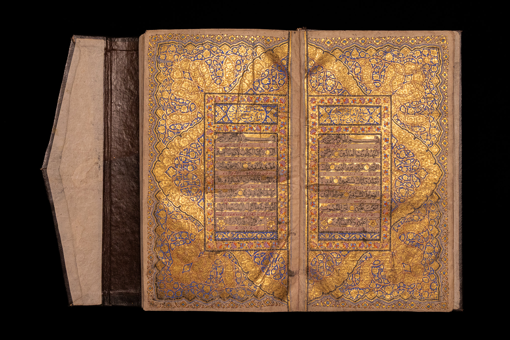 AN ILLUMINATED QUR'AN WITH PERSIAN INTERLINEAR TRANSLATION. QAJAR-ERA PERSIA, 19TH CENTURY. MANUSCRIPT ON PAPER.