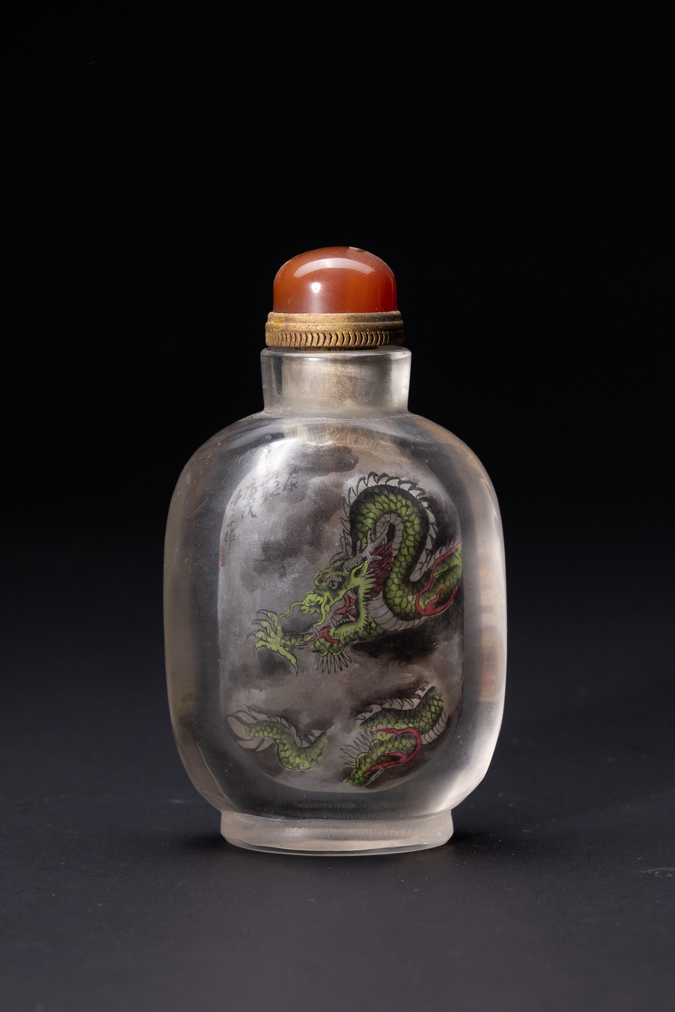 A CHINESE INSIDE-PAINTED GLASS SNUFF BOTTLE WITH DRAGON AND CLOUDS MOTIF SIGNED YE ZHONG.