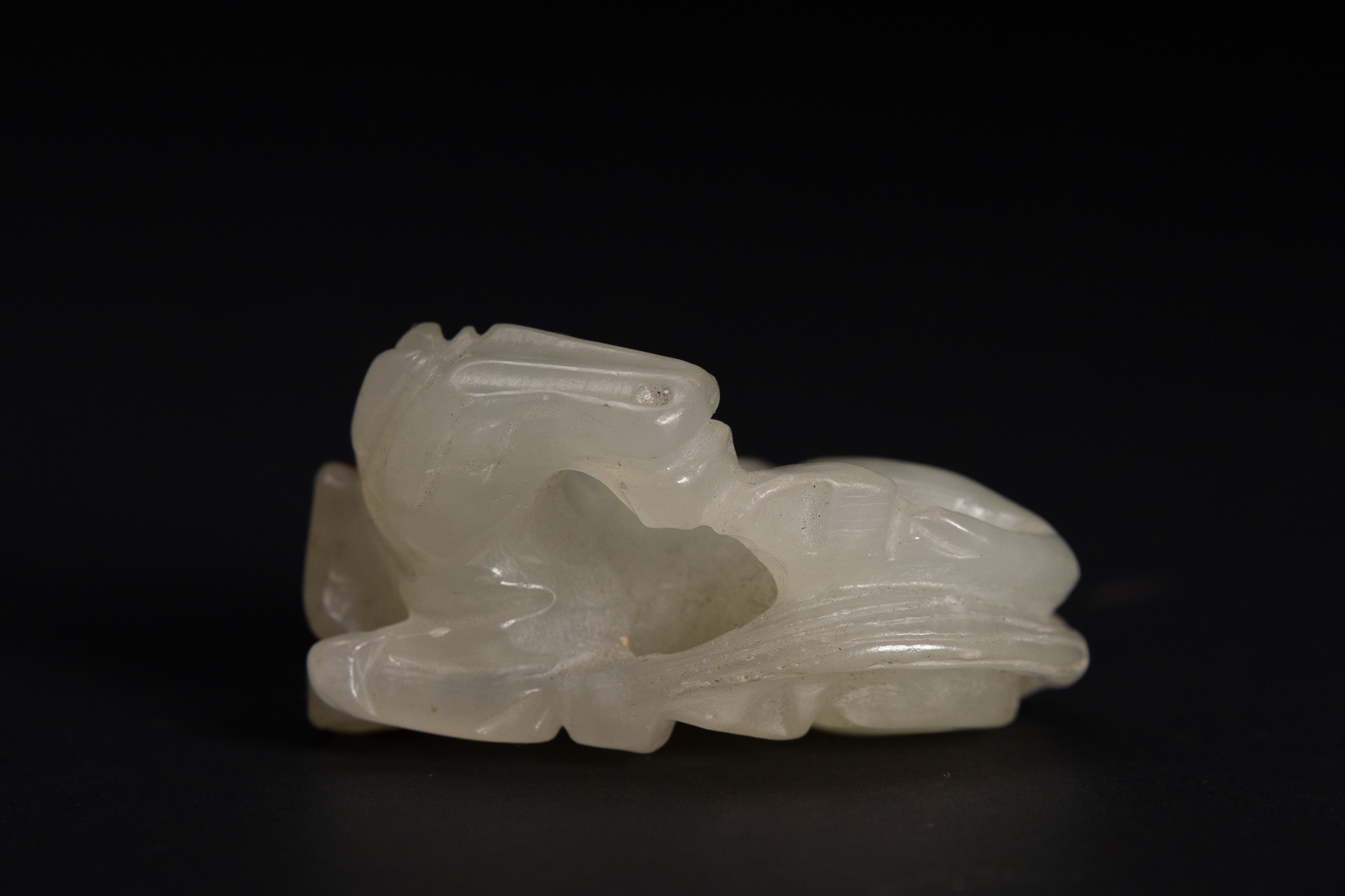 A CHINESE CARVED PALE CELADON NEPHRITE JADE HORSE GROUP.