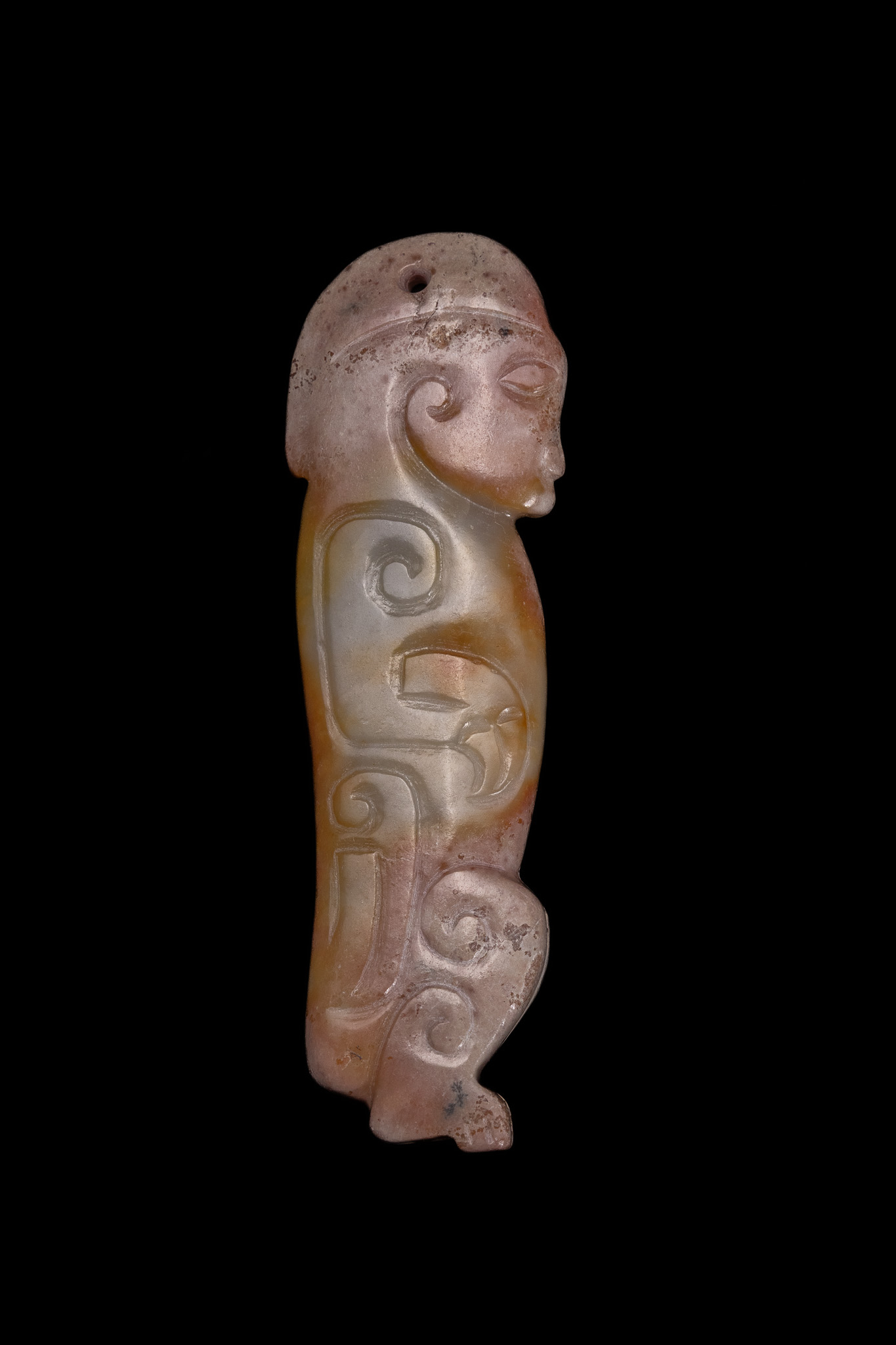 A CHINESE ARCHAIC STYLE CARVED JADE ANTHROPOMORPHIC PENDANT