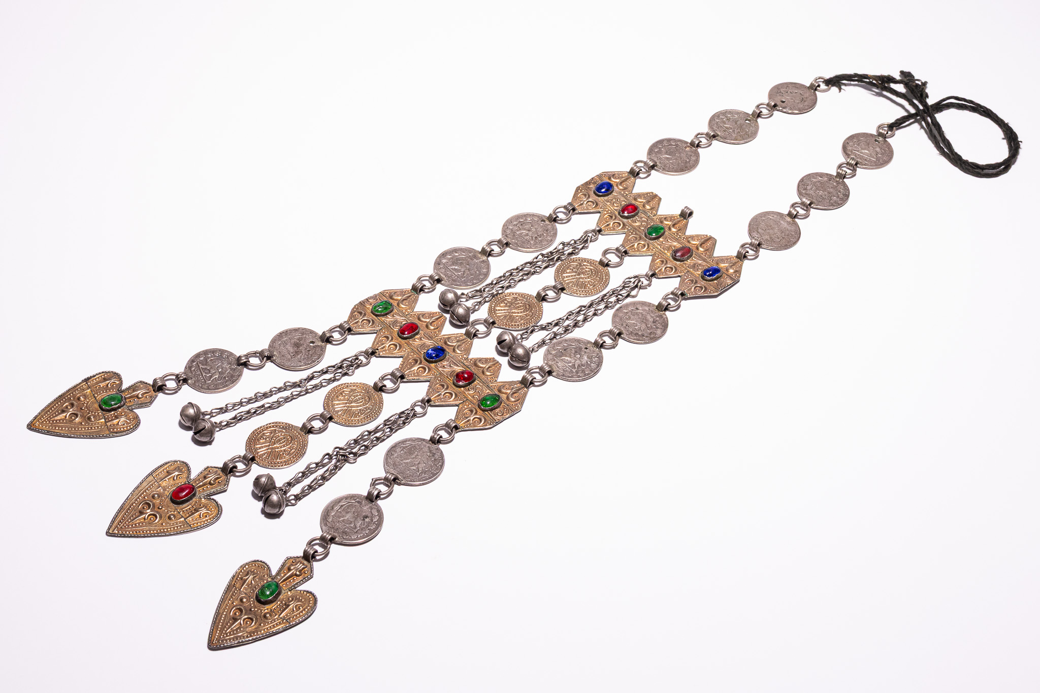 A PERSIAN TRIBAL SILVER AND GILT METAL MULTI STRAND COIN PECTORAL NECKLACE.
