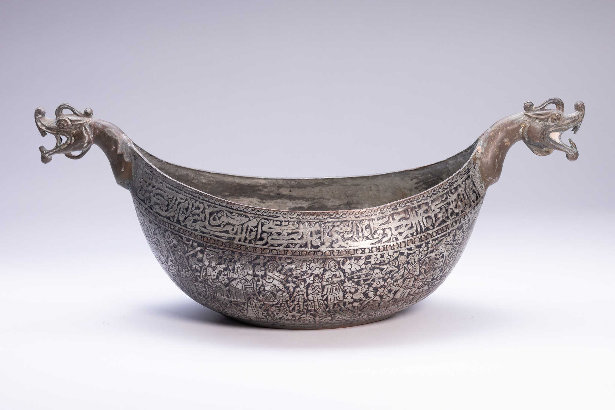 AN INDO-PERSIAN TINNED-COPPER KASHKUL (BEGGING BOWL).