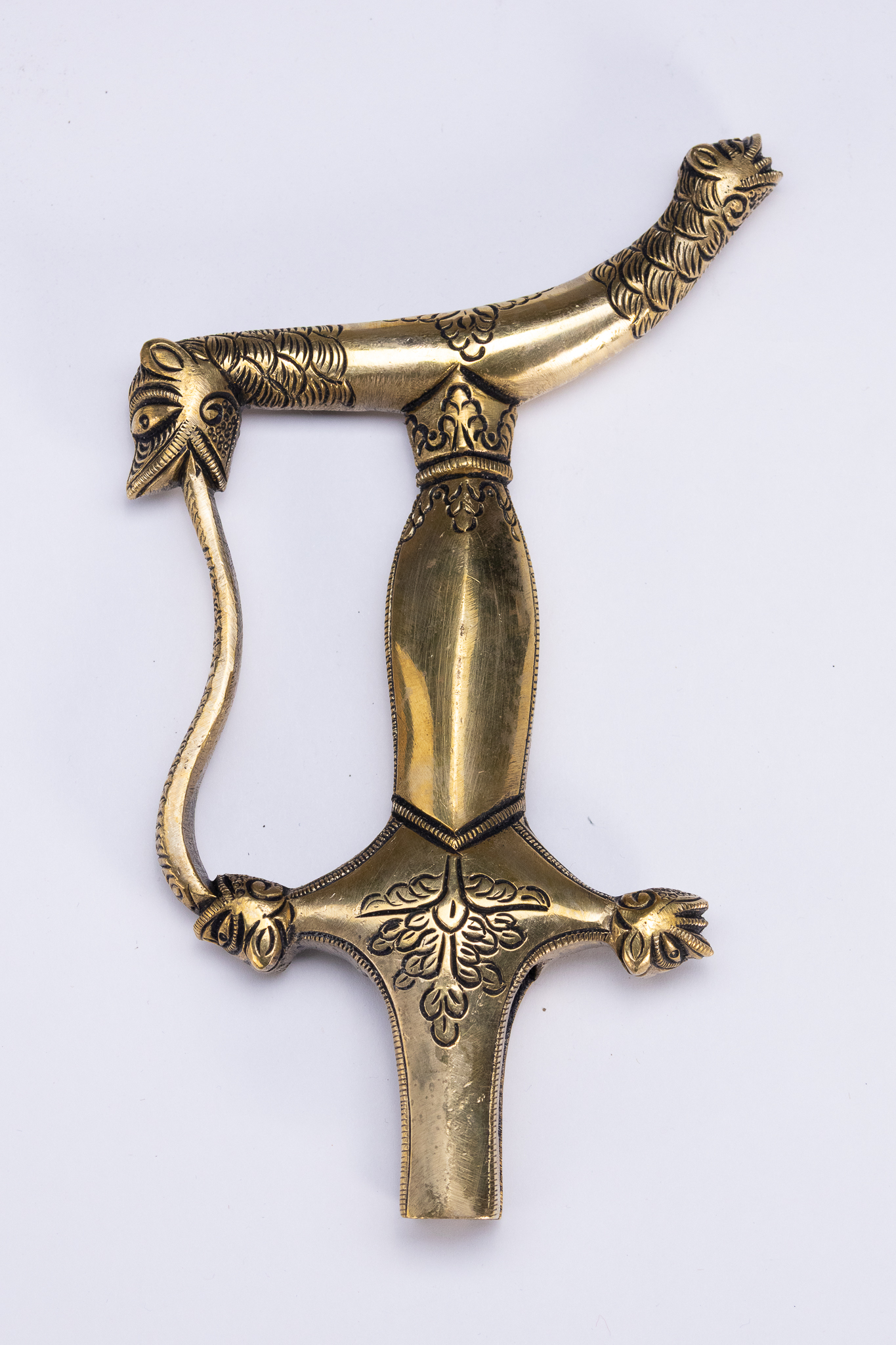 A SOUTH INDIAN CAST BRASS ZOOMORPHIC TULWAR HILT, 19TH CENTURY OR LATER.