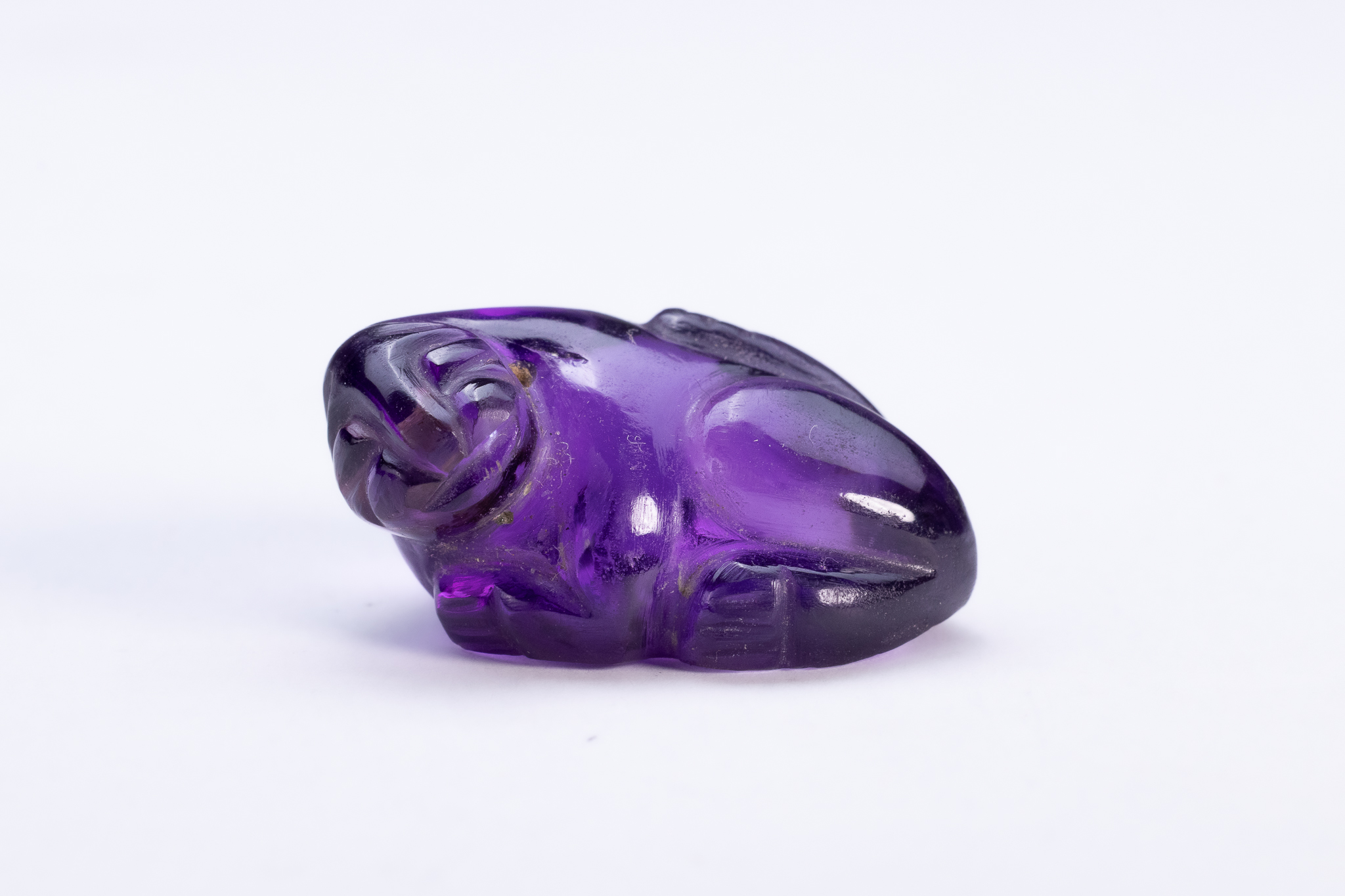 AN ANCIENT EGYPTIAN AMETHYST SPHINX AMULET, MIDDLE KINGDOM, CIRCA 2030–1640 B.C.