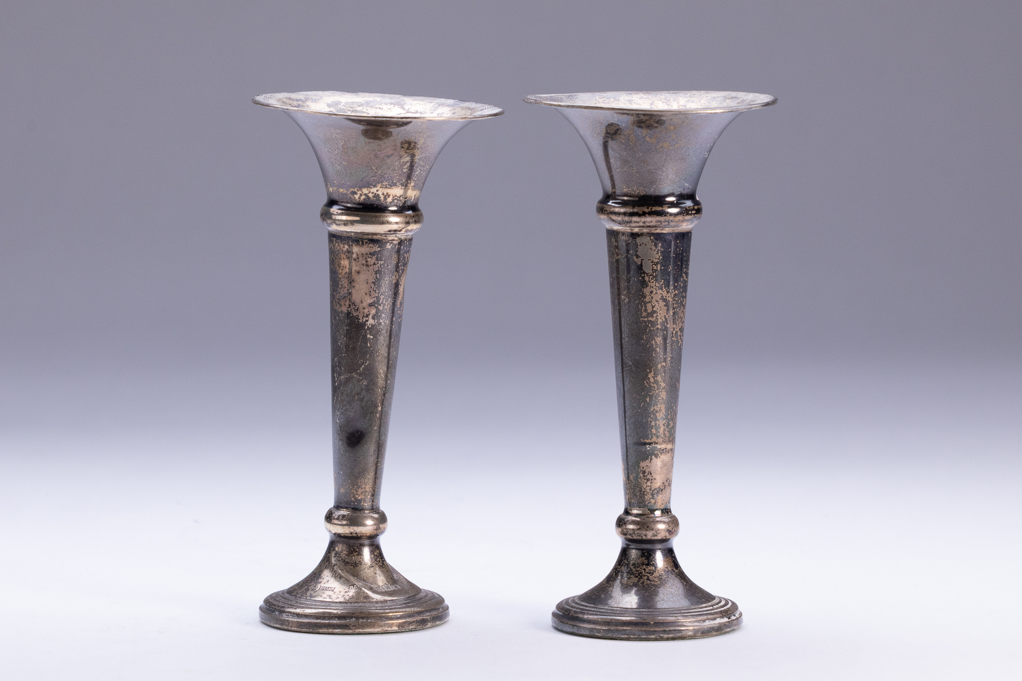 A PAIR OF GEORGE V STERLING SILVER WEIGHTED TRUMPET VASES, BARKER BROTHERS SILVER LTD, BIRMINGHAM, 1914