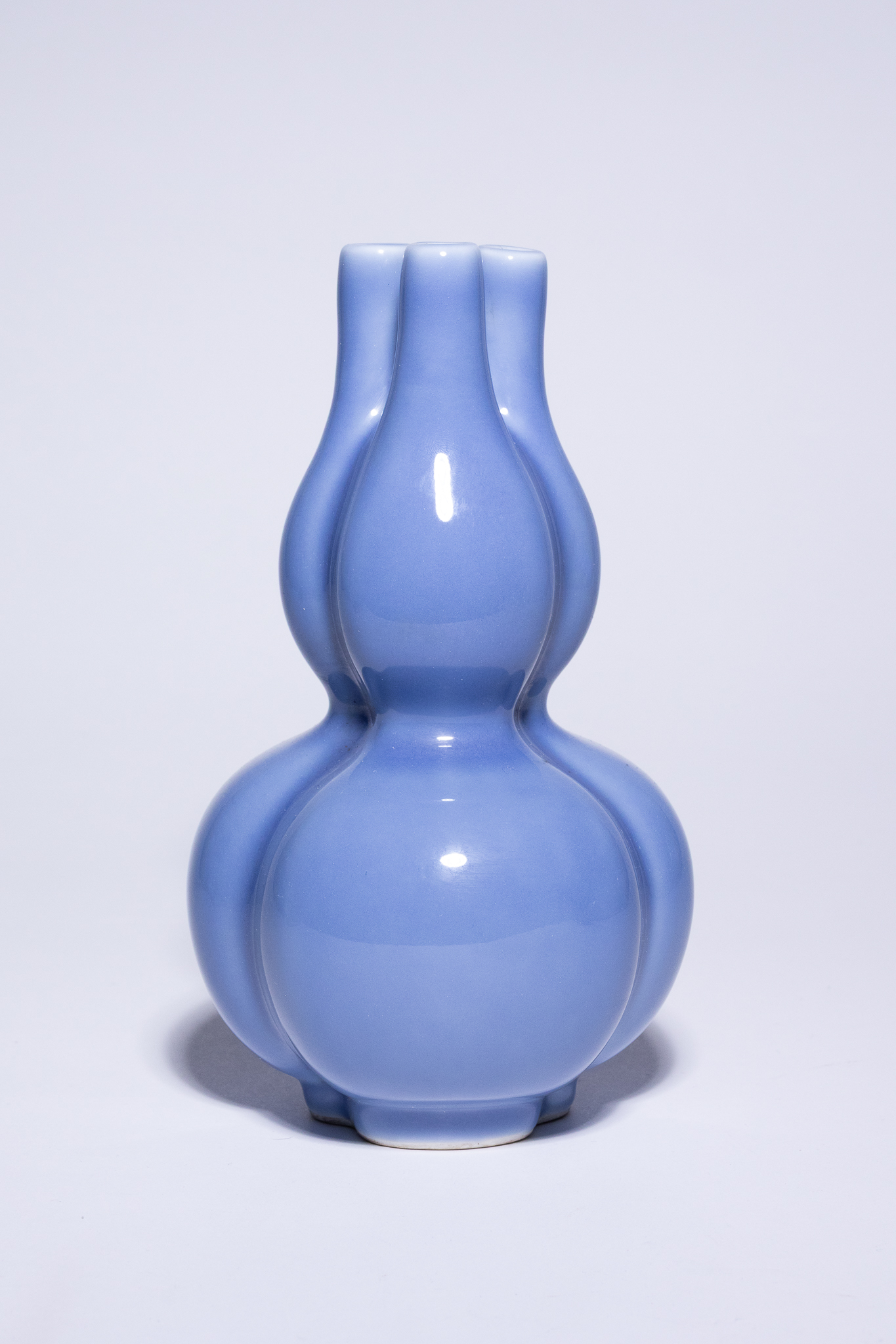 A CHINESE LAVENDER-BLUE GLAZED TRIPLE-GOURD VASE, QIANLONG MARK.
