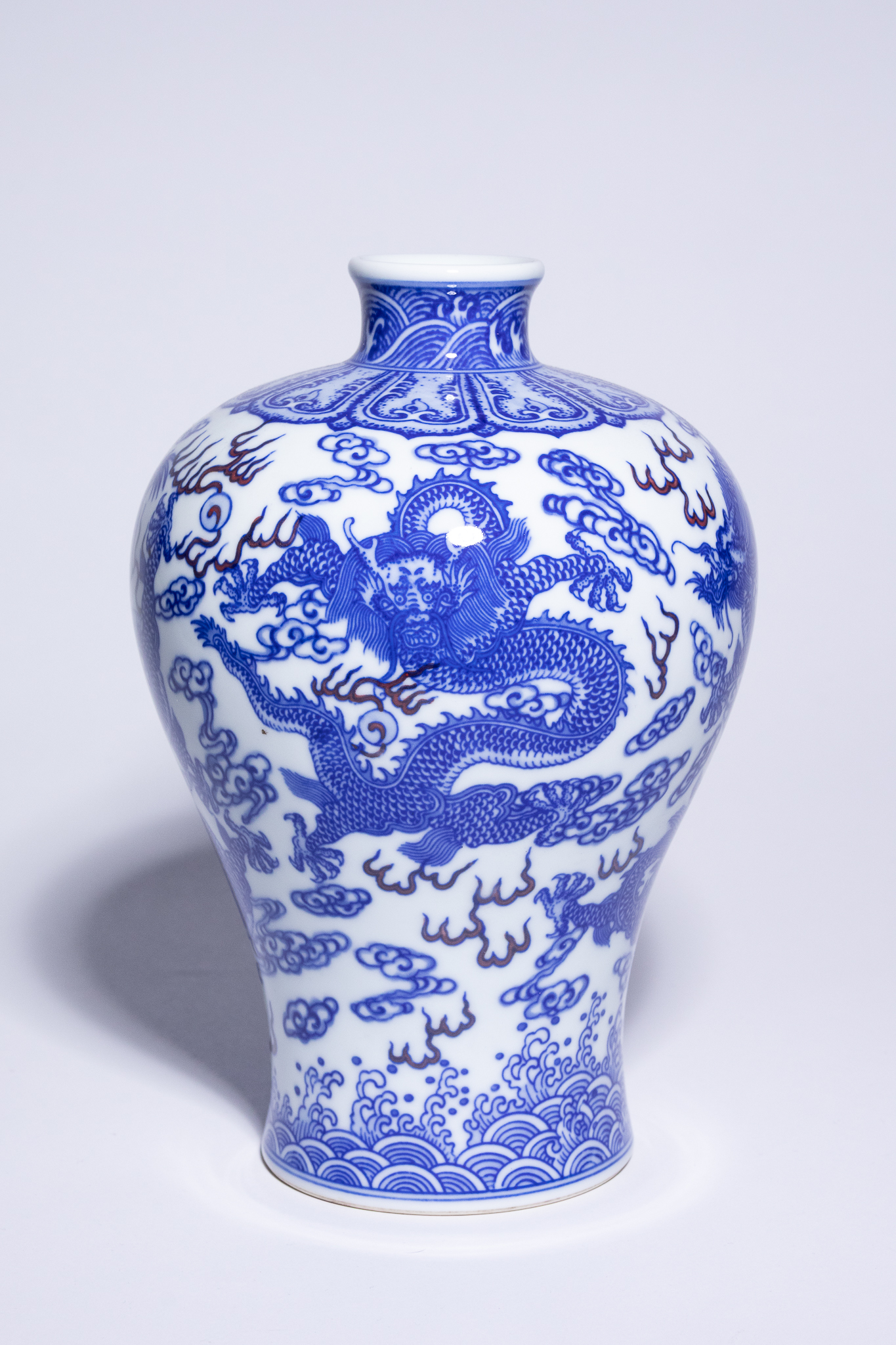 A CHINESE BLUE AND WHITE AND IRON-RED PORCELAIN DRAGON MEIPING VASE, YONGZHENG MARK.