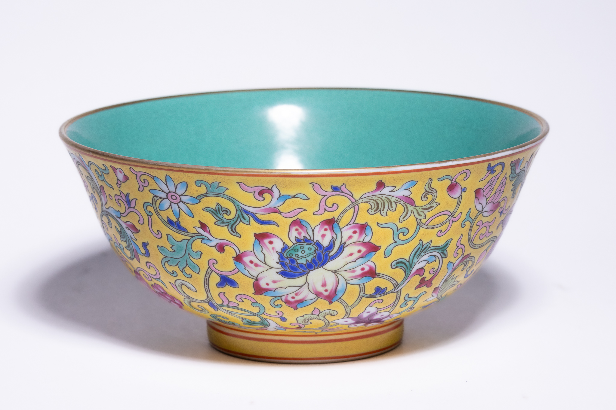 A CHINESE YELLOW-GROUND FAMILLE ROSE LOTUS BOWL, YONGZHENG MARK.