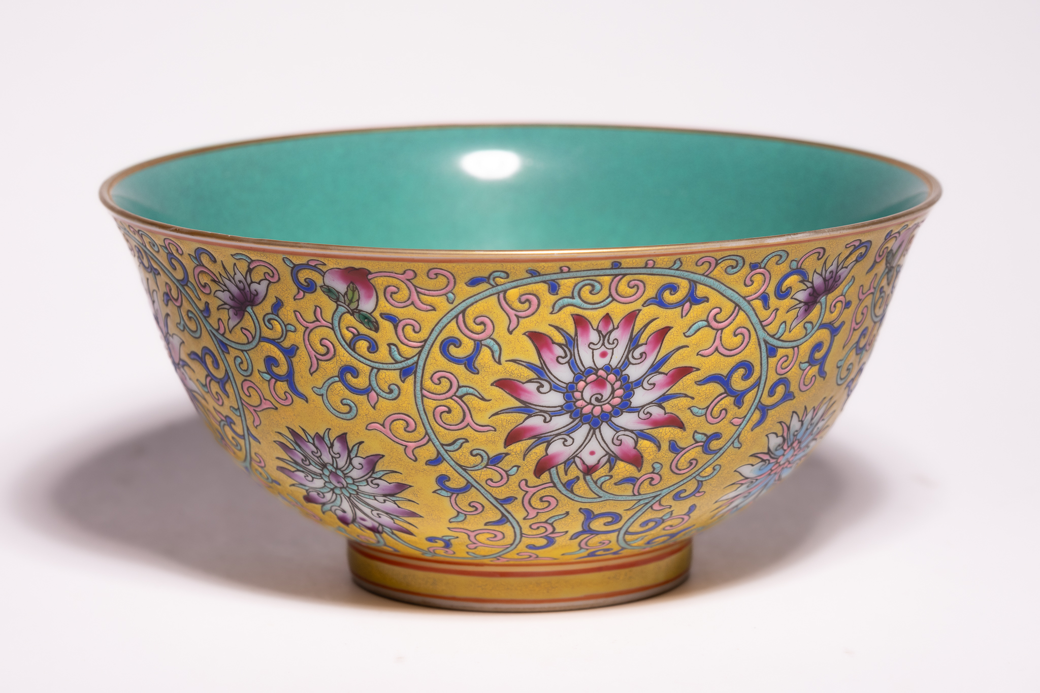A CHINESE FAMILLE ROSE YELLOW-GROUND COMMEMORATIVE BOWL, YONGZHENG MARK.