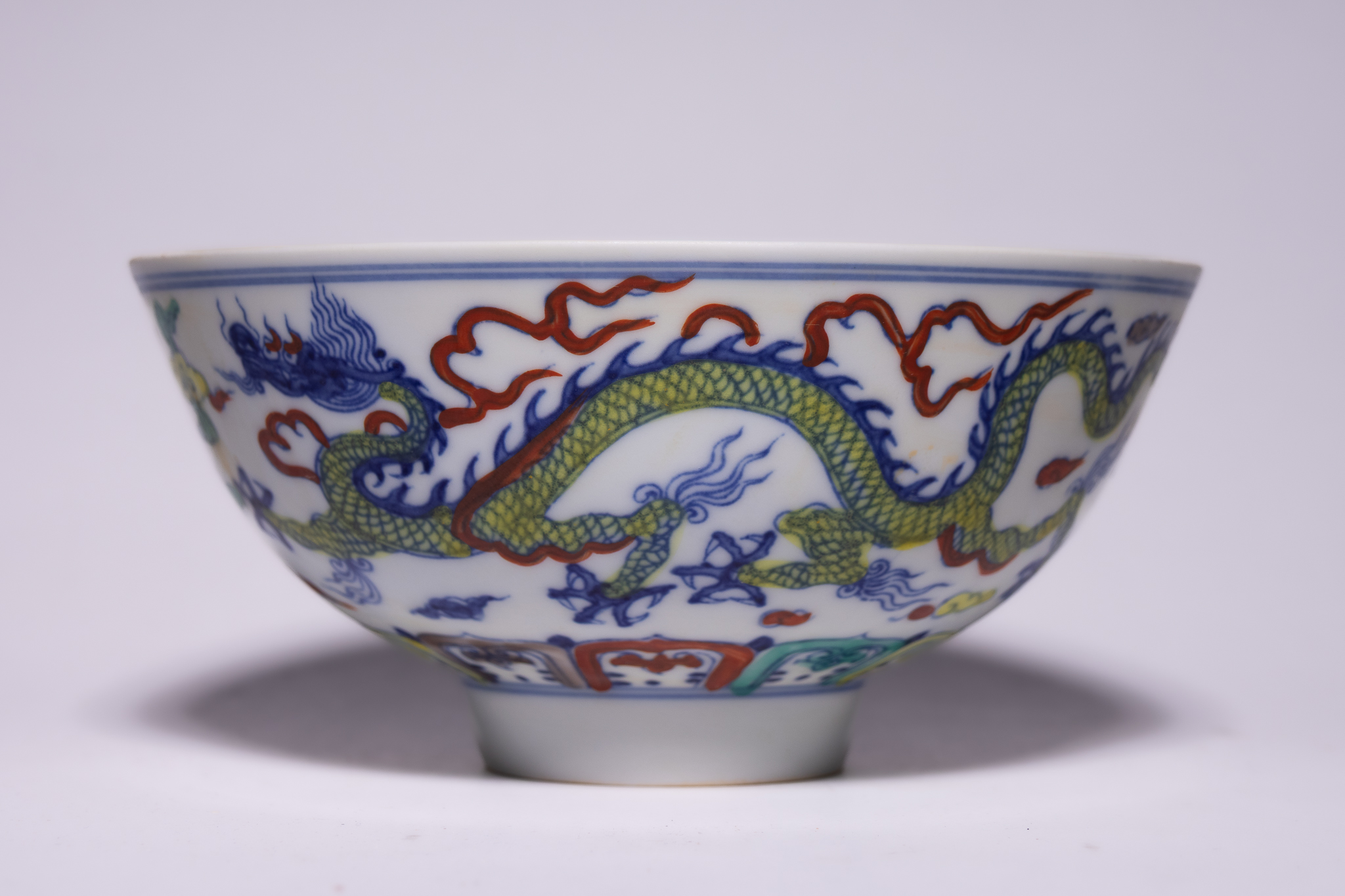 A CHINESE DOUCAI PORCELAIN DRAGON BOWL, CHENGHUA MARK.