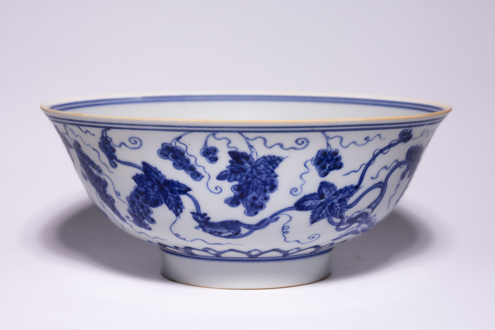 A CHINESE BLUE AND WHITE PORCELAIN SQUIRREL AND GRAPE BOWL, CHENGHUA MARK.