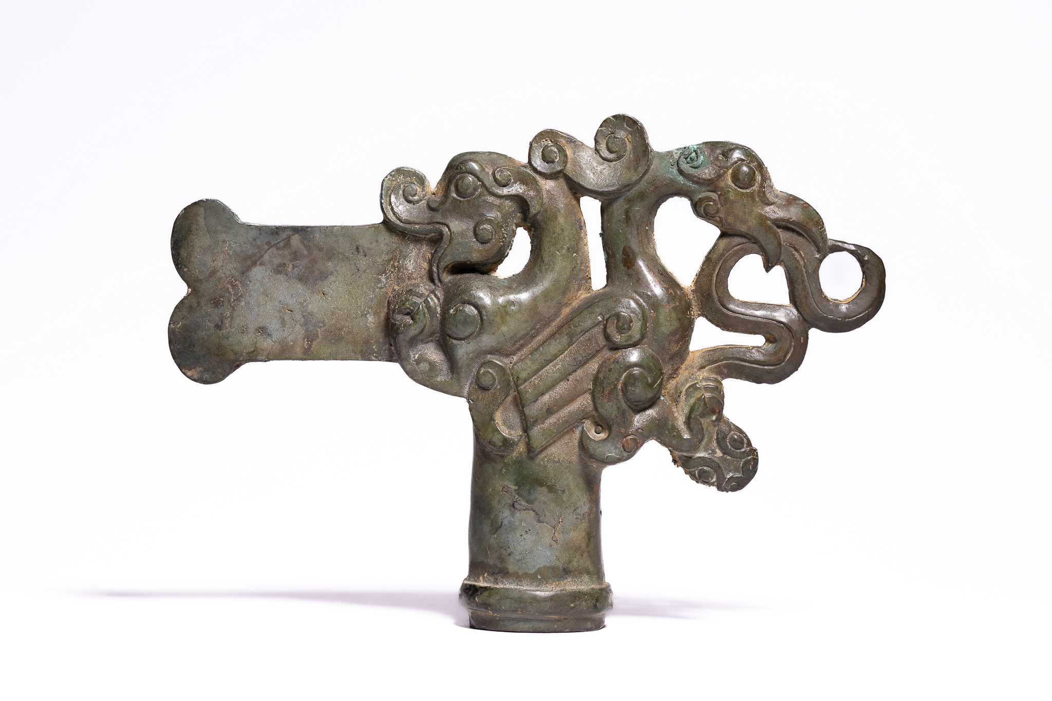 A CHINESE BRONZE ZOOMORPHIC CEREMONIAL FINIAL, POSSIBLY WARRING STATES.