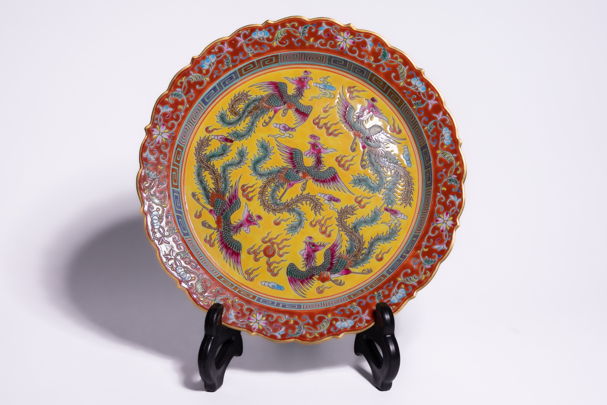A CHINESE FAMILLE ROSE YELLOW GROUND PHOENIX DISH, YONGZHENG MARK.