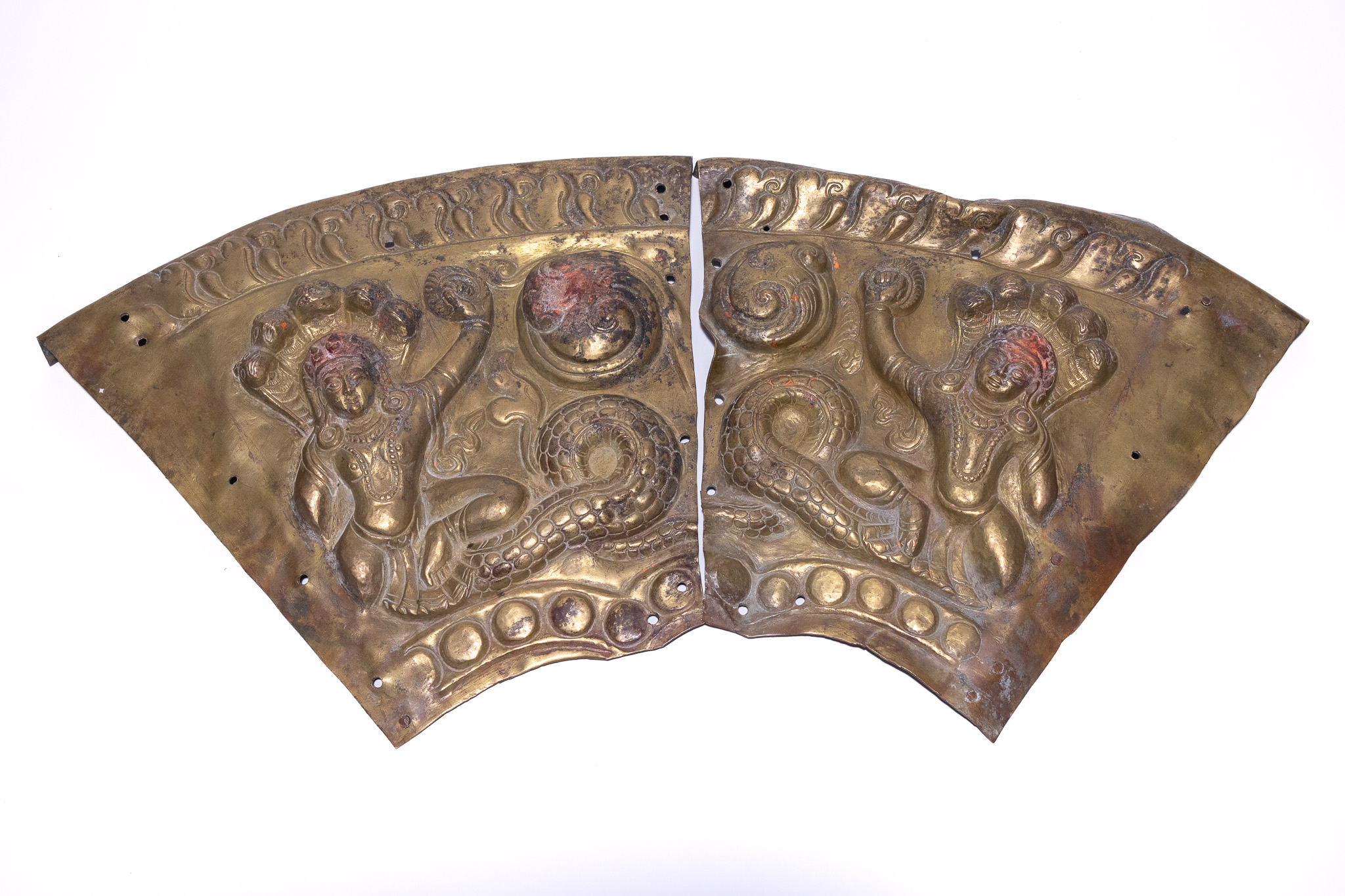 A PAIR OF NEPALESE RITUAL REPOUSSÉ COPPER ALLOY NAGA PLAQUES, 18TH-19TH CENTURY.