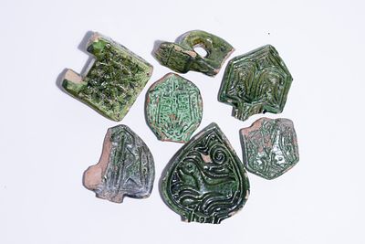 A COLLECTION OF AYUBBID PERIOD MOULDED AND GREEN-GLAZED EARTHENWARE FRAGMENTS, 9TH-10TH CENTURY. 