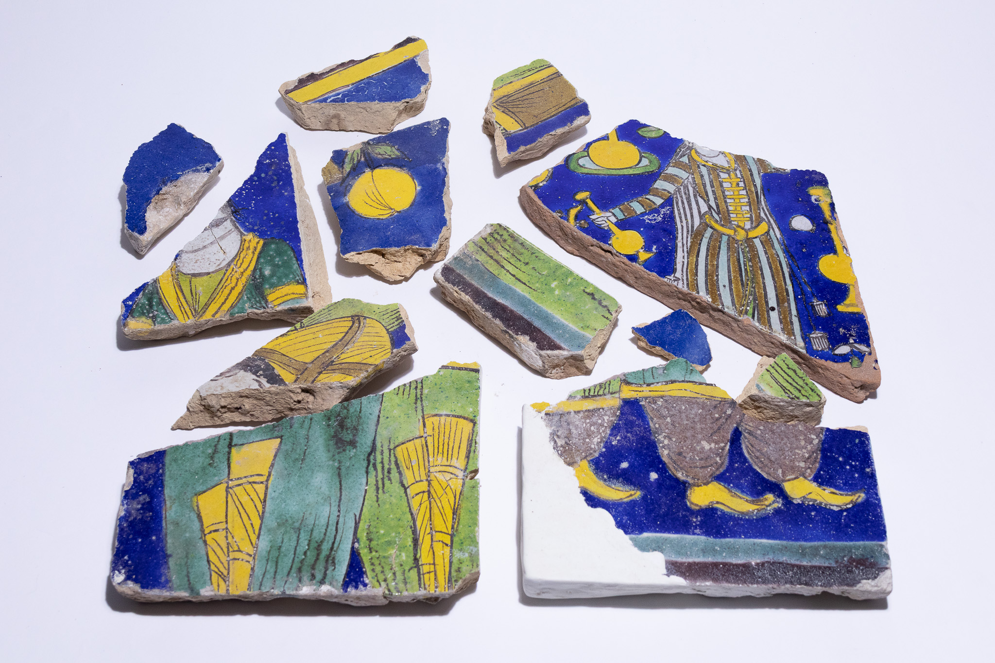 A COLLECTION OF SAFAVID FIGURATIVE CUERDA SECA TILE FRAGMENTS, PERSIA, 17TH CENTURY.