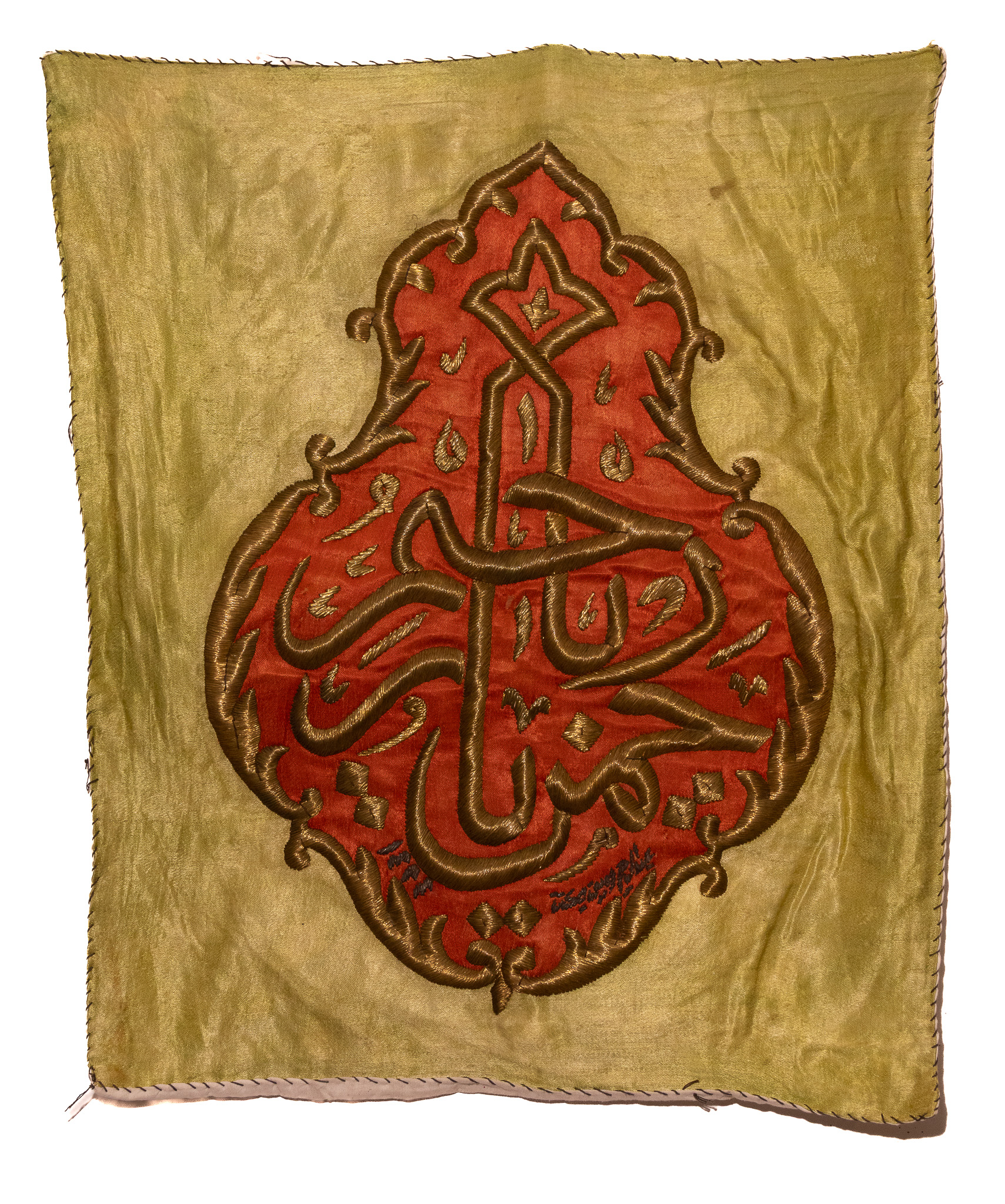 A LATE OTTOMAN EMBROIDERED CALLIGRAPHIC PANEL DATED 1327 AH.