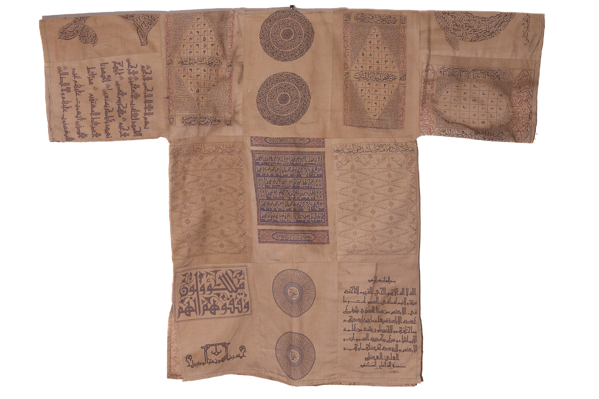 AN OTTOMAN TALISMANIC SHIRT (TAWIZ SHIRT) WITH QURANIC INSCRIPTIONS AND MAGIC SQUARES.