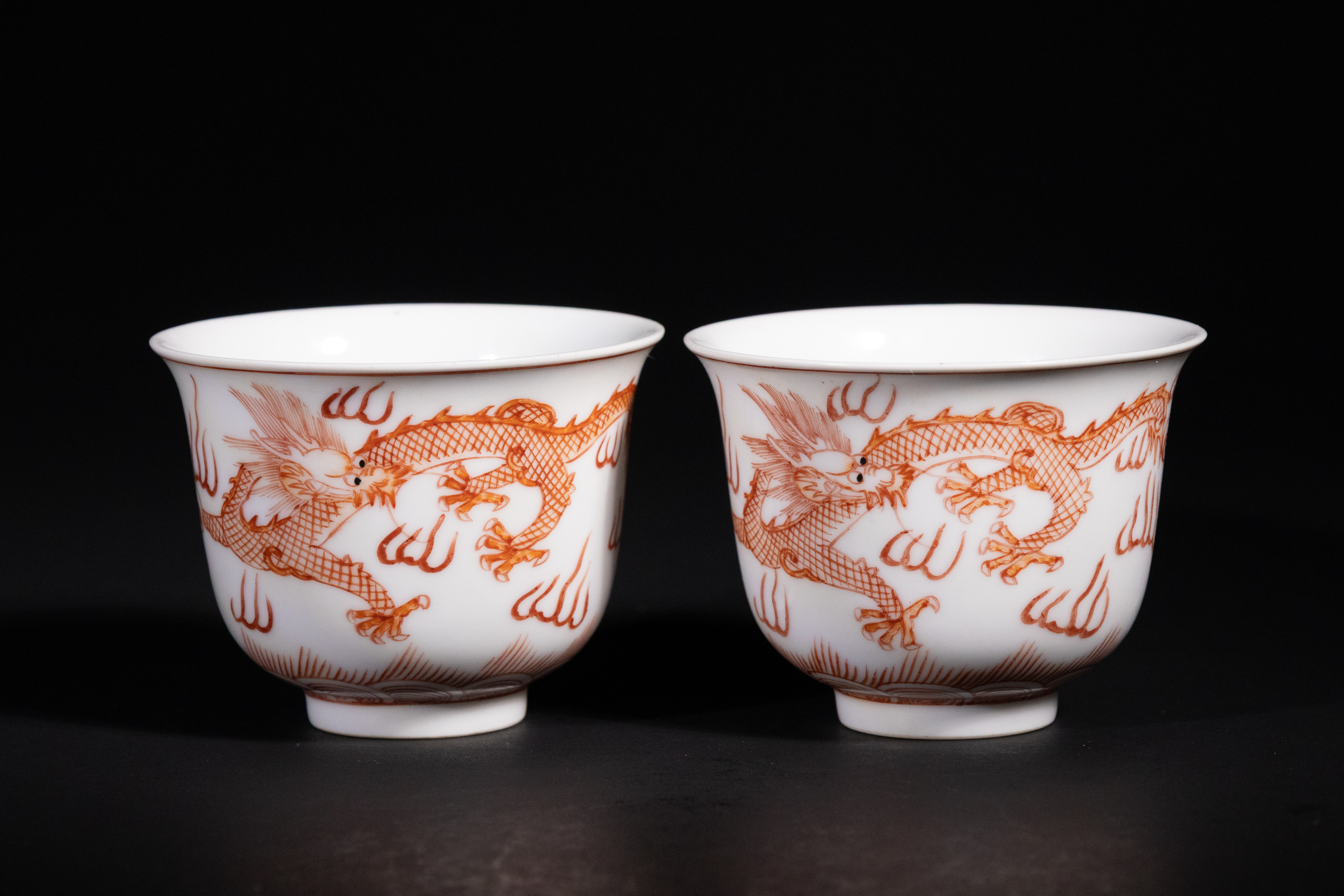 A Pair of Chinese Iron-Red Decorated 'Dragon' Porcelain Cups, Da Qing Qianlong Nian Zhi Mark
