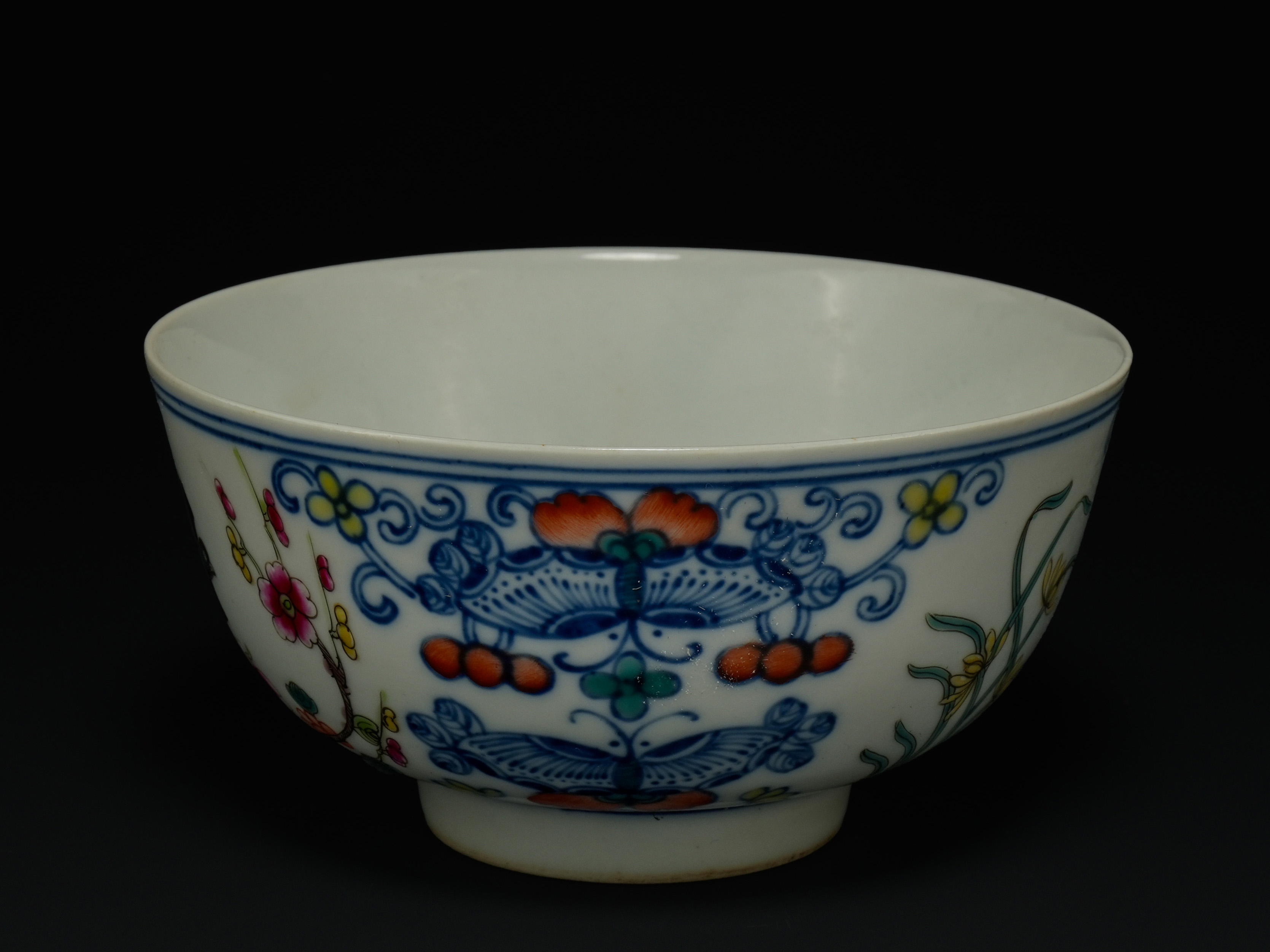 A Chinese Guangxu Doucai Butterfly and Floral Bowl