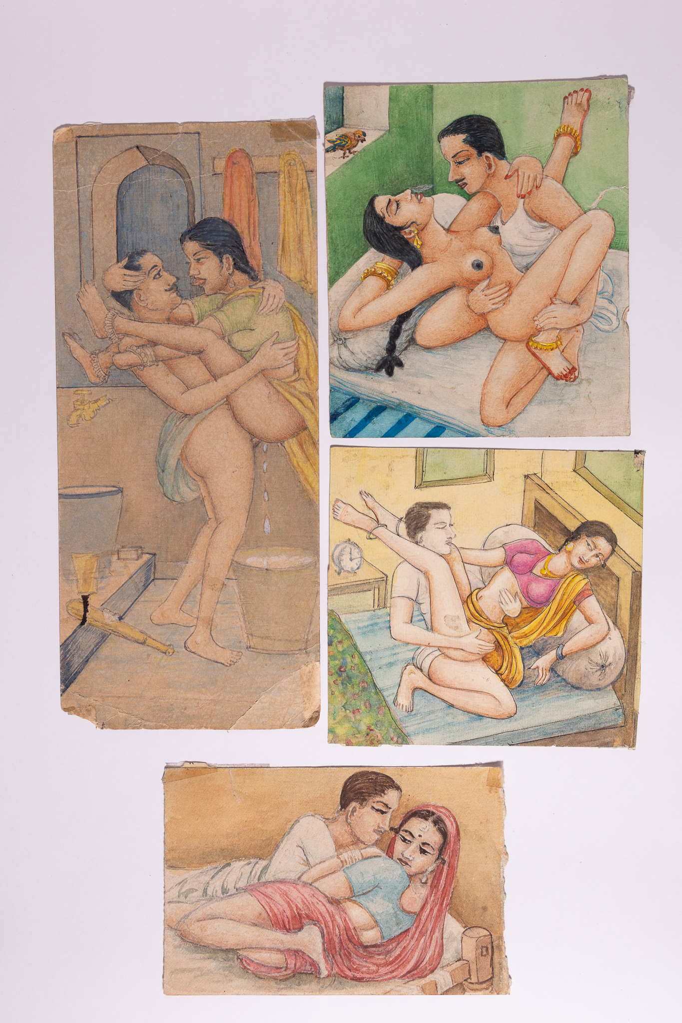 A SET OF FOUR INDIAN EROTIC KAMA SUTRA MINIATURE PAINTINGS.
