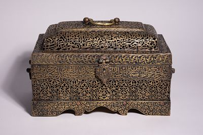 A QAJAR PIERCED AND ENGRAVED BRASS QUR'AN BOX, PERSIA, 19TH CENTURY. This rectangular brass 