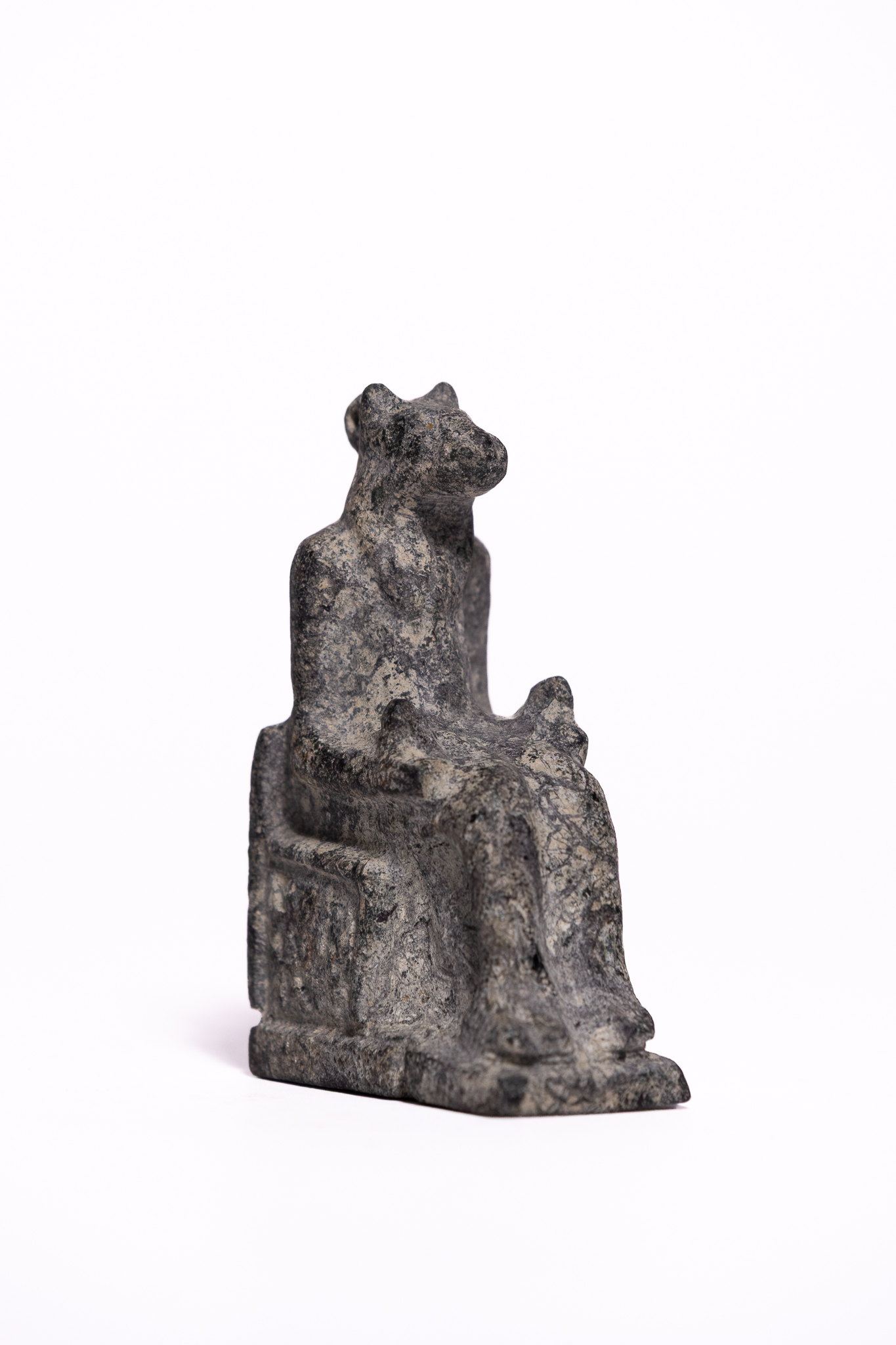 AN EGYPTIAN CARVED STONE AMULET OF A SEATED LIONESS-HEADED GODDESS, LATE PERIOD TO PTOLEMAIC PERIOD, 664-30 B.C.
